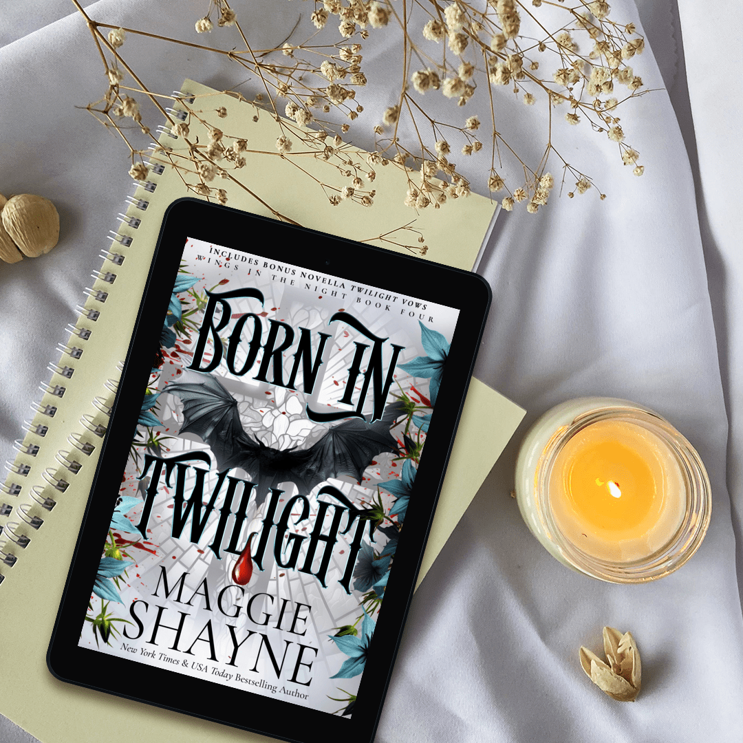 Maggie Shayne's Born in Twilight lifestyle 1 flowers, candle, ebook on notebooks